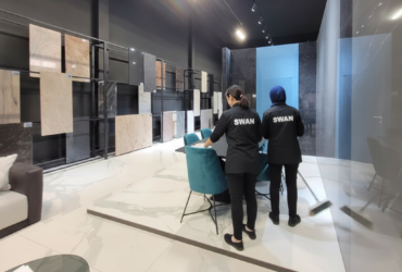 freepik__add-two-female-cleaners-from-behind-with-white-swa__82203